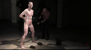 Japanese bdsm master jeering a bound guy with various tools and durian fruit